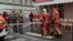 FILE - Firefighters push a gurney on a street after gunshots were fired in central Paris, France, Dec. 23, 2022, in this still image obtained form a social media video.