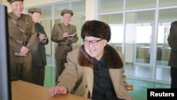 FILE - Kim Jong Un watches the test of an ICBM engine at the Sohae space center in Cholsan County, North Korea, in an undated KCNA photo. He watched a similar test at the same site on Dec. 16, 2022, state media said.