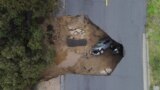 Several people had to be rescued after two vehicles fell into a sinkhole in Chatsworth, California, Jan. 10, 2023. 