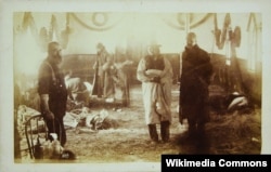 The makeshift hospital inside the Holy Cross Episcopal Church on the Pine Ridge Agency where wounded Lakota were cared for following the Massacre at Wounded Knee, S.D., 1891. Note the Christmas decorations still hanging.