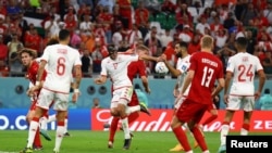 The ball appears to hit the hand of Tunisia's Yassine Meriah before referee Cesar Arturo Ramos checks the VAR screen and rules it accidental and no penalty on November 22, 2022.
