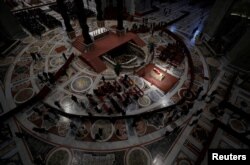 Faithful pay homage to former Pope Benedict, as his body lies in state at St. Peter's Basilica, at the Vatican, Jan. 3, 2023.