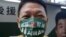 A supporter wears a mask with the Taiwan national flag and slogan reading 'Taiwan is awesome' during an election campaign in Taipei, Nov. 20, 2022. 