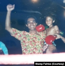 Young Stamp Fairtex posed with her father, also a Thai boxer.