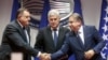 Bosnian Serb leader Milorad Dodik, left and Bosniac leader Nermin Niksic shake hands in Sarajevo, Bosnia, Dec. 15, 2022. Three diplomats told The Associated Press that Bosnia has been granted candidate status into the European Union.