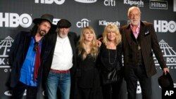 FILE - Members of Fleetwood Mac, from left, Mike Campbell, John McVie, Stevie Nicks, Christine McVie and Mick Fleetwood, appear at the Rock & Roll Hall of Fame induction ceremony in New York, March 29, 2019.