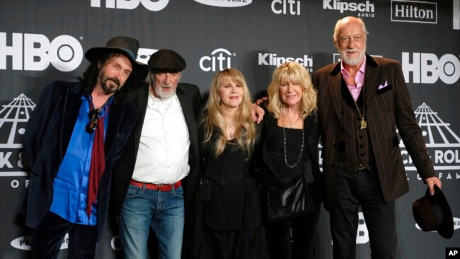 FILE - Members of Fleetwood Mac, from left, Mike Campbell, John McVie, Stevie Nicks, Christine McVie and Mick Fleetwood, appear at the Rock & Roll Hall of Fame induction ceremony in New York, March 29, 2019.