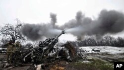 Ukrainian servicemen shoot towards Russian positions in the frontline at an undisclosed location in the Donetsk region, Ukraine, Nov. 23, 2022. 