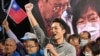 Taiwan's main opposition Kuomintang (KMT) candidate Chiang Wan-an waves after winning the Taipei mayoral election during a rally in Taipei on Nov. 26, 2022. 