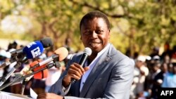 FILE—Togolese President and presidential candidate of the ruling Union for the Republic (UNIR) party Faure Gnassingbe delivers a speech during a campaign rally in Dapaong, northern Togo, on February 16, 2020. 