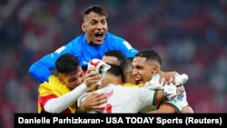 Moroccan players celebrate winning their final World Cup group match against Canada, Qatar, December 1, 2022, 