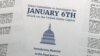 FILE - Halaman depan ringkasan laporan Komisi yang dibentuk oleh Dewan Perwakilan Rakyat untuk menyelidiki serangan 6 Januari 2021 di Capitol, gedung Kongres AS di Washington, DC, 19 Desember 2022. (AP/Jon Elswick, File)