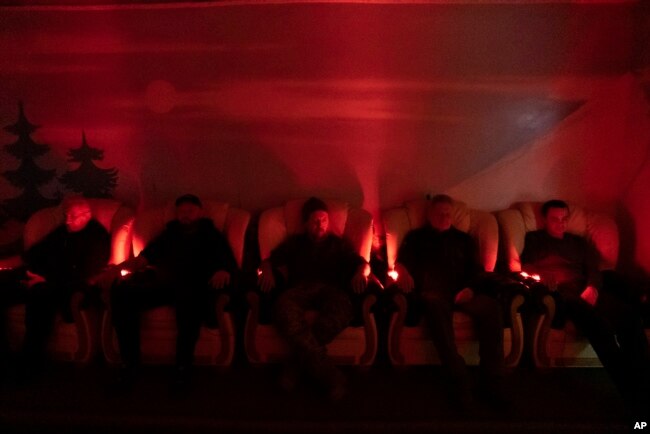 Ukrainian soldiers undergo laser therapy at a rehabilitation center in Kharkiv region, Ukraine, Friday, Dec. 30, 2022. (AP Photo/Vasilisa Stepanenko)