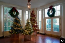 The East Wing of the White House is decorated with trees dedicated to Gold Star families for the holiday season during a press preview of holiday decorations at the White House, Nov. 28, 2022, in Washington.