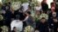 Pele's daughter, Kelly Cristina Nascimento, is seen next to the body of Brazilian soccer legend Pele in his casket, as he lays in state on the pitch of his former club Santos' Vila Belmiro Stadium in Santos, Jan. 2, 2023.