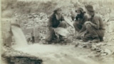 FILE - "Old timers, Spriggs, Lamb and Dillon at work" panning for gold (pay dirt) at Rockervill, S.D., in the Black Hills, 1889. (John C. H. Grabill/Library of Congress)