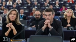 European Parliament members listen to assembly President Roberta Metsola during a special session on lobbying, Dec. 12, 2022 at the European Parliament in Strasbourg, eastern France. 