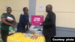 BULAWAYO MAYOR HANDS OVER FOOD AND CLOTHING FROM THE MAYOR'S CHRISTMAS CHEER FUND TO THORNGROVE HOSPITAL STAFF