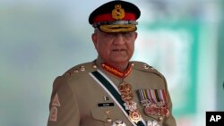 FILE - Pakistan's Army Chief General Qamar Javed Bajwa arrives for a military parade to mark Pakistan National Day in Islamabad, Pakistan, March 23, 2022.