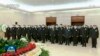 2022年12月5日，中国中央电视台播放的视频截图中，中国国家主席习近平和前任胡锦涛与其他领导人一起向前国家主席江泽民的遗体表示敬意。