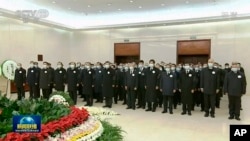 中共前领导人胡锦涛在江泽民追悼仪式上露面。（2022年12月6日）