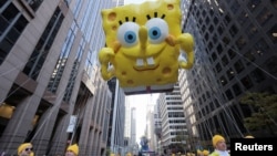 A SpongeBob SquarePants balloon floats through the streets of Manhattan during the 96th Macy's Thanksgiving Day Parade in New York, Nov. 24, 2022