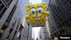 A SpongeBob SquarePants balloon floats through the streets of Manhattan during the 96th Macy's Thanksgiving Day Parade in New York City, Nov. 24, 2022