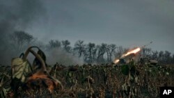 A Ukrainian military Grad multiple rocket launcher fires at Russian positions in the front line near Bakhmut, Donetsk region, Ukraine, Nov. 24, 2022.