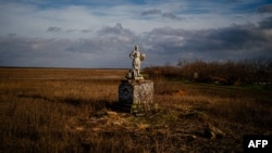 FILE: This photograph taken on December 30, 2022, shows a damaged statue next to an abandoned Russian military position in Kherson region, amid the Russian invasion of Ukraine.