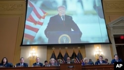 A video presentation plays as the House select committee investigating the Jan. 6 attack on the US Capitol holds its final meeting on Capitol Hill, Dec. 19, 2022. 