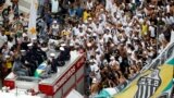 The casket of Brazilian soccer legend Pele is transported to the to the Santos' Memorial Cemetery during his funeral procession in Santos, Jan. 3, 2023.
