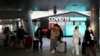 Passengers arriving from China pass by a COVID-19 testing center at the Incheon International Airport In Incheon, South Korea, Jan. 10, 2023. 