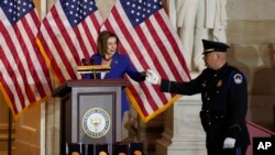 Speak of the House Nancy Pelosi of Calif., steps on stage during a Congressional Gold Medal ceremony honoring law enforcement officers who defended the U.S. Capitol on Jan. 6, 2021, in the U.S. Capitol Rotunda in Washington, Dec. 6, 2022.