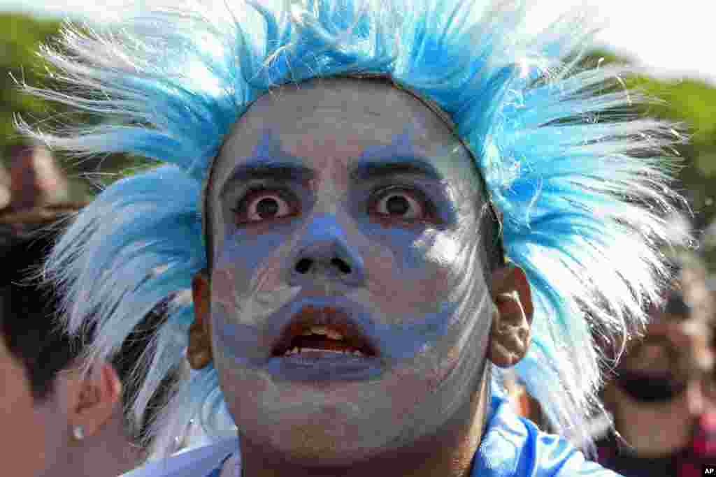 An Argentina soccer fan watches the team lose to Saudi Arabia at a World Cup Group C soccer match, played on a large screen in the Palermo neighborhood of Buenos, Aires.