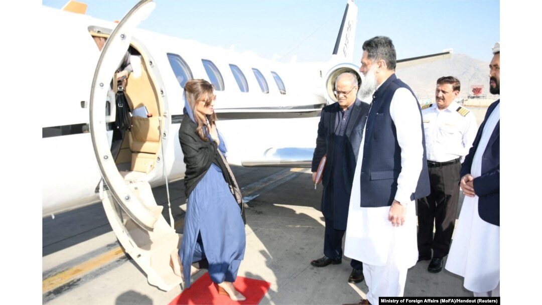 Pakistan's Minister of State Hina Rabbani Khar, left, greets Ubaid-ur-Rahman Nizamani, head of Mission of Embassy of Pakistan, right, upon her arrival in Kabul, Afghanistan, Nov. 29, 2022.
