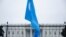 FILE - A Uyghur flag is held high on Pennsylvania Avenue in front of the White House during a protest against the Chinese Communist Party, Oct. 1, 2022.