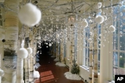 The East Colonnade of the White House is decorated for the holiday season during a press preview of holiday decorations at the White House, Nov. 28, 2022, in Washington.