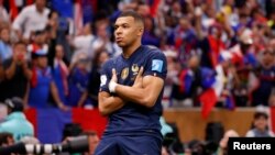 FILE: Dec 18, 2022; France forward Kylian Mbappe (10) celebrates after scoring a goal against Argentina on a penalty kick for his third goal of the match during extra time of the 2022 World Cup final at Lusail Stadium. Mandatory Credit: Yukihito Taguchi-USA TODAY Sports