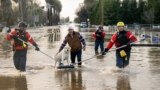 San Diego firefighters help Humberto Maciel rescue his dog from his flooded home in Merced, California, Jan. 10, 2023. 