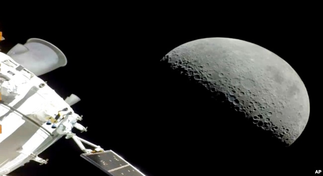 NASA's Orion spacecraft flew past the moon on Monday, December 5, 2022. The crew capsule splashed down on Sunday, December 11, 2022 after a three-week test flight, setting the stage for astronauts on the next flight in a couple years. (NASA via AP)