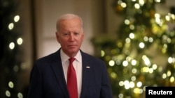 U.S. President Joe Biden pauses while delivering a Christmas speech at the White House in Washington, Dec. 22, 2022.