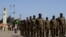 FILE: Soldiers from different army corps to be decorated with medals arrive during the 62nd anniversary of the creation of the Burkina Faso Armed Forces at the Nation Square in Ouagadougou on November 1, 2022.