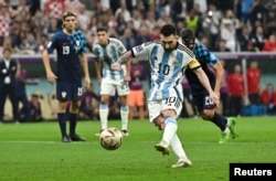 Argentina's Lionel Messi scores the team's first goal from the penalty spot in the FIFA World Cup Qatar 2022 semifinal against Croatia in Lusail, Qatar, Dec. 13, 2022.