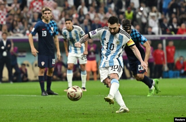 Argentina's Lionel Messi scores the team's first goal from the penalty spot in the FIFA World Cup Qatar 2022 semifinal against Croatia in Lusail, Qatar, Dec. 13, 2022.