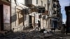 A local resident enters a shop in Bakhmut, Donetsk region, Dec. 2, 2022.