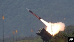 FILE - A U.S.-made Patriot missile is launched during an annual exercise in Ilan County, 80 kilometers (49 miles) west of Taipei, Taiwan, on July 20, 2006. 