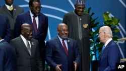 U.S. President Joe Biden talks with African leaders before they pose for a family photo during the U.S.-Africa Leaders Summit at the Walter E. Washington Convention Center in Washington, Dec. 15, 2022.