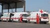 FILE - Lebanese Red Cross vehicles are parked at the Lebanese-Syrian border crossing in Arida, Lebanon, Sept. 23, 2022.