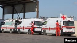FILE - Lebanese Red Cross vehicles are parked at the Lebanese-Syrian border crossing in Arida, Lebanon, Sept. 23, 2022.