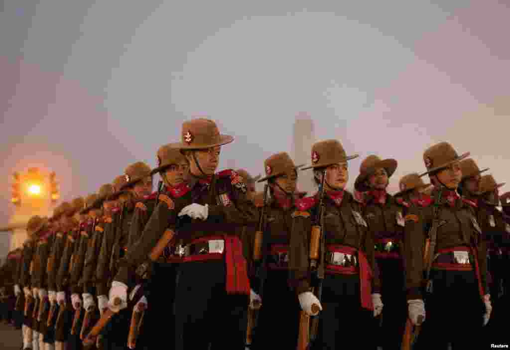 Indian soldiers take part in the rehearsal for the Republic Day parade on a cold winter morning, in New Delhi, India.